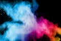 Abstract multi color powder explosion on black background. Royalty Free Stock Photo