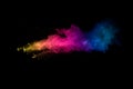 Abstract multi color powder explosion on black background. Freeze motion of colorful dust particles splash. Painted Holi Royalty Free Stock Photo