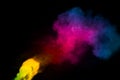 Abstract multi color powder explosion on black background.  Freeze motion of colorful dust  particles splash. Painted Holi Royalty Free Stock Photo