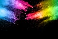 Abstract multi color powder explosion on black background. Royalty Free Stock Photo