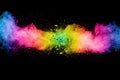 Abstract multi color powder explosion on black background.