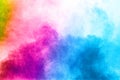Abstract multi color powder explosion on white background. Royalty Free Stock Photo