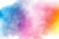 Abstract multi color powder explosion on white background.Freeze motion of dust particles splash Royalty Free Stock Photo