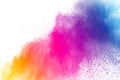 Abstract multi color powder explosion on white background. Royalty Free Stock Photo