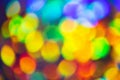 Abstract multi colored bokeh. Soft focus, defocus. Orange, yellow, green, blue. Festive background Royalty Free Stock Photo