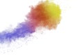 Abstract multi colored powder explosion on white background. Freeze motion of colorful dust  particle splash Royalty Free Stock Photo