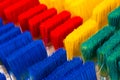 Abstract multicolor texture background, renovation concept, row of many multicolored brushes close up, texture renovation and crea