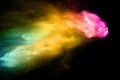 Abstract multicolored dust explosion on black background. Abstract color powder splash on dark background Royalty Free Stock Photo