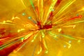 Abstract multicolored festive lights on a yellow and orange background. Royalty Free Stock Photo