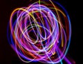 Abstract multicolored lines drawn by light on a black background Royalty Free Stock Photo