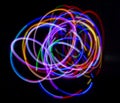 Abstract multicolored lines drawn by light on a black background Royalty Free Stock Photo