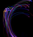 Abstract multicolored lines drawn by light on a black background Royalty Free Stock Photo