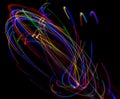 Abstract multicolored lines drawn by light on a black background Royalty Free Stock Photo