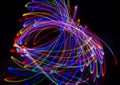Abstract multicolored lines drawn by light on a black background Royalty Free Stock Photo