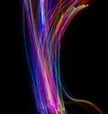 Abstract multicolored lines drawn by light on a black background Royalty Free Stock Photo