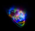 Abstract multicolored lines drawn by light on a black background Royalty Free Stock Photo