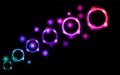 Abstract, multicolored, neon, bright, glowing circles, balls, bubbles, planets with stars on a black background of space. The back