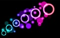 Abstract, multicolored, neon, purple, pink, bright, glowing circles, balls, bubbles, planets with stars on a black background of s Royalty Free Stock Photo