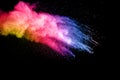 Freeze motion of color dust particles splash. Painted Holi Royalty Free Stock Photo