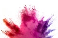 Abstract multicolored powder splash on white background.Freeze motion of color powder exploding