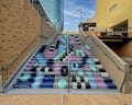 Abstract mural by artist Mari Pohlman painted on concrete steps at Mockingbird Station in Dallas, Texas.