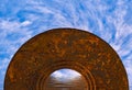 Abstract mystical semi-circular archway in the ocean with swirling white clouds