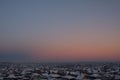 Abstract natural sky background over a provincial town. Space for copy. Morning winter blue-pink sky over the village. Twilight Royalty Free Stock Photo