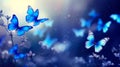 Abstract natural spring background with butterflies and light blue dark meadow flowers closeup. Royalty Free Stock Photo