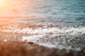 Abstract nature summer ocean sunset sea background. Small waves on water surface in motion blur with bokeh lights from Royalty Free Stock Photo