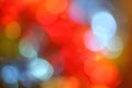 Abstract background of bright glittering lights, Christmas red blue yellow holiday bokeh Royalty Free Stock Photo