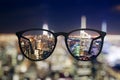 Abstract night city view through eyeglasses Royalty Free Stock Photo