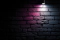 Abstract night lighting casts a captivating glow on a dark brick wall