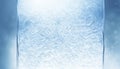 Abstract openwork frosty pattern on icy flat surface. On delicate blue winter background with bokeh Royalty Free Stock Photo