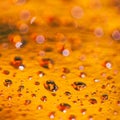 Abstract orange background with water drops Royalty Free Stock Photo