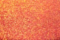 Abstract orange bright background with multicolored sparkles