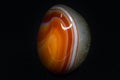 Abstract orange carnelian agate chalcedony with clear quartz tumbled crystal