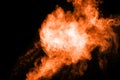 Abstract orange dust explosion on black background. Royalty Free Stock Photo