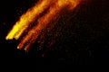 Abstract orange dust explosion on black background. Royalty Free Stock Photo