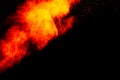 Abstract orange dust explosion on black background. Royalty Free Stock Photo