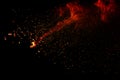 Abstract orange dust explosion on black background. Royalty Free Stock Photo