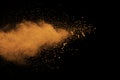 Abstract orange dust explosion on black background. Royalty Free Stock Photo