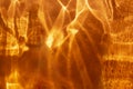 Abstract orange fire like background with shadows and sparkles. Royalty Free Stock Photo