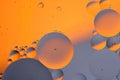 Abstract orange gray background with oil circles water surface.