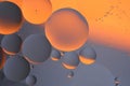 Abstract orange gray background with oil circles water surface.