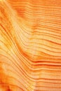 Abstract orange lines on a wooden board