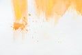 Abstract orange watercolor painting with splatters