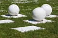 Abstract outdoor composition of white balls on bases Royalty Free Stock Photo
