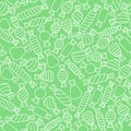 Abstract outlined white candies on the green background. Seamless
