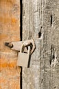 Abstract padlock rusty brass brown knocker in a closed wood door bansk