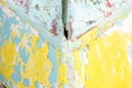 Abstract paint background with random patterns of layers of aged and weathered paint on a wood surface